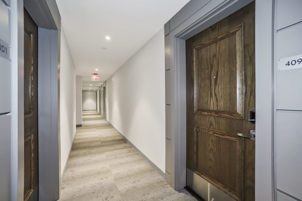 Long and spacious hallways through the apartment common areas at Madrona Apartments in Washington, District of Columbia