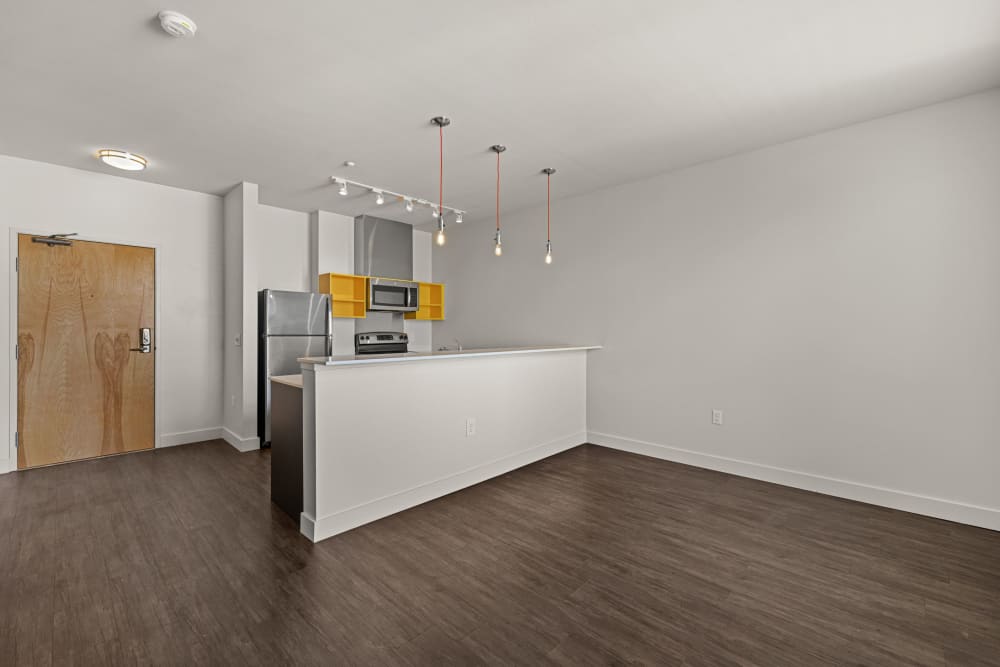 View of kitchen from the living area at Anthem on 12th in Seattle, Washington