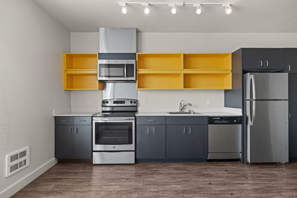 Open cabinets in the kitchen at Anthem on 12th in Seattle, Washington