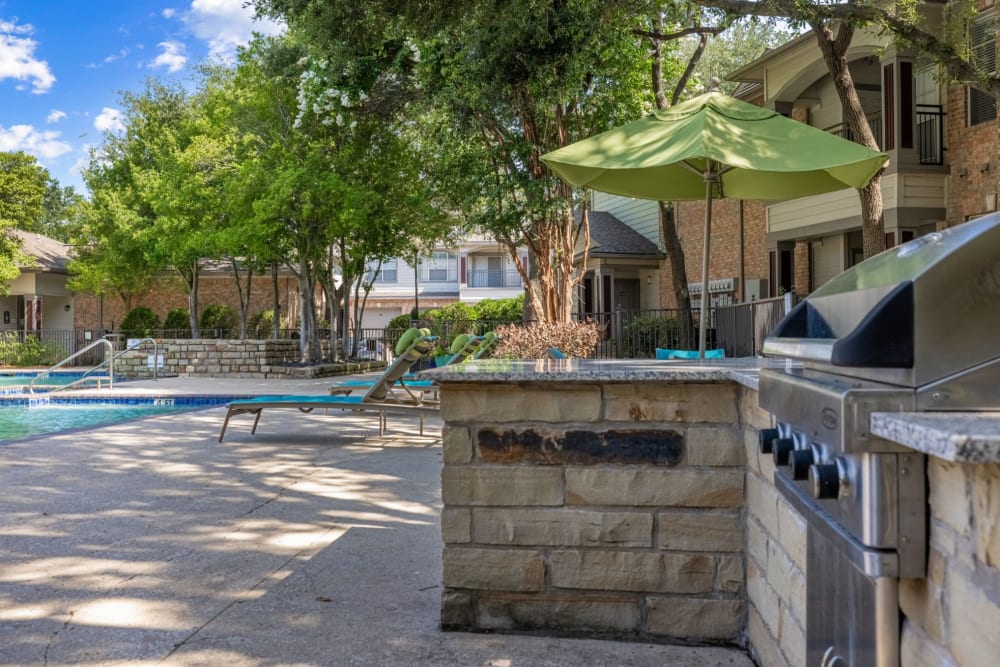 Grills near the pool at Brooks on Preston in Plano, Texas