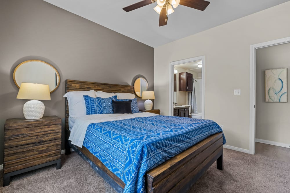  Bedroom with a ceiling fan at Brooks on Preston in Plano, Texas