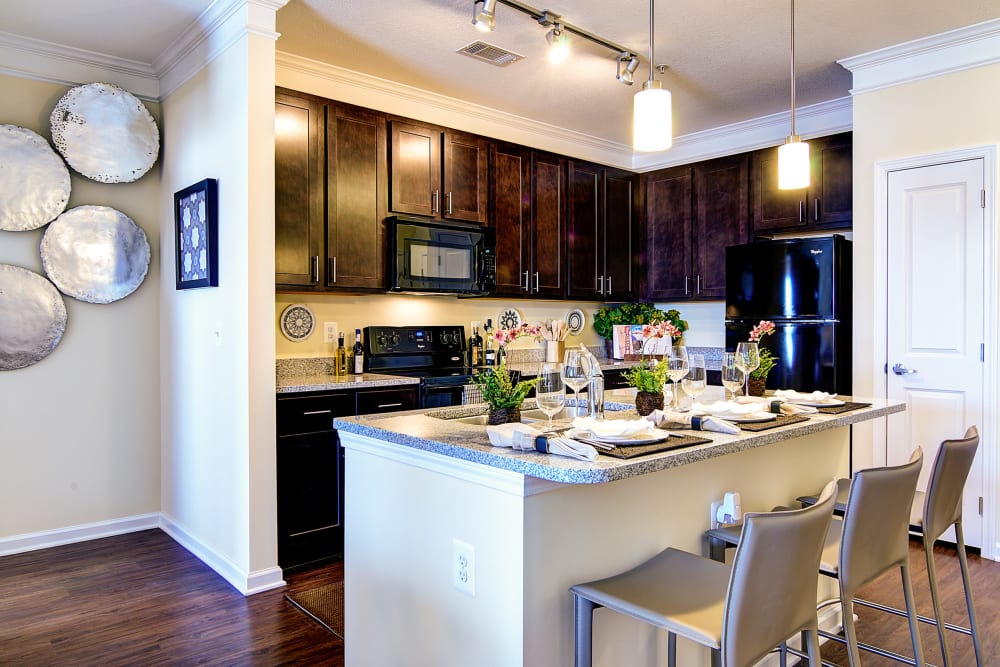 Large breakfast bar where residents can eat and hang out in the kitchen without getting in the way at The Retreat at Market Square in Frederick, Maryland