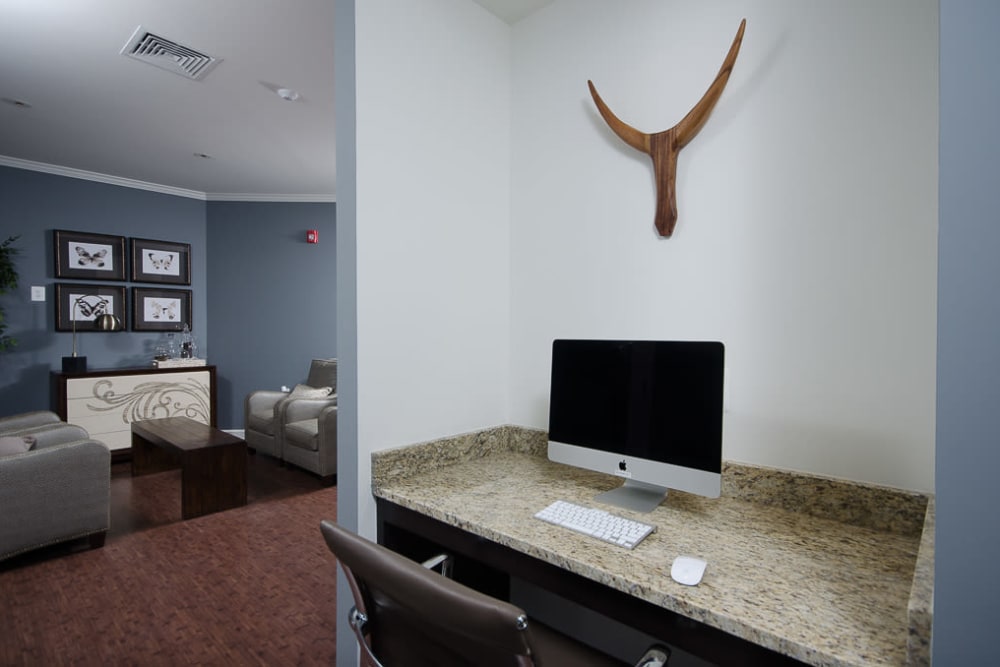 Office area with a computer for residents to use in the clubhouse at The Retreat at Market Square in Frederick, Maryland