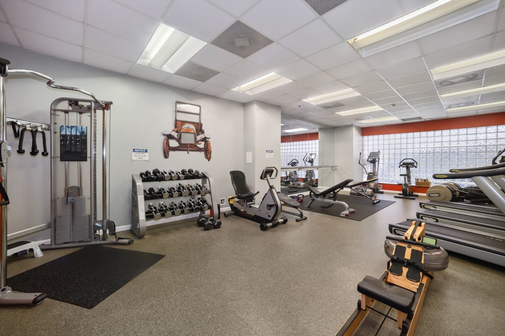 Full fitness center with cardio machines and free weights for residents to use anytime at Winston House in Washington, District of Columbia
