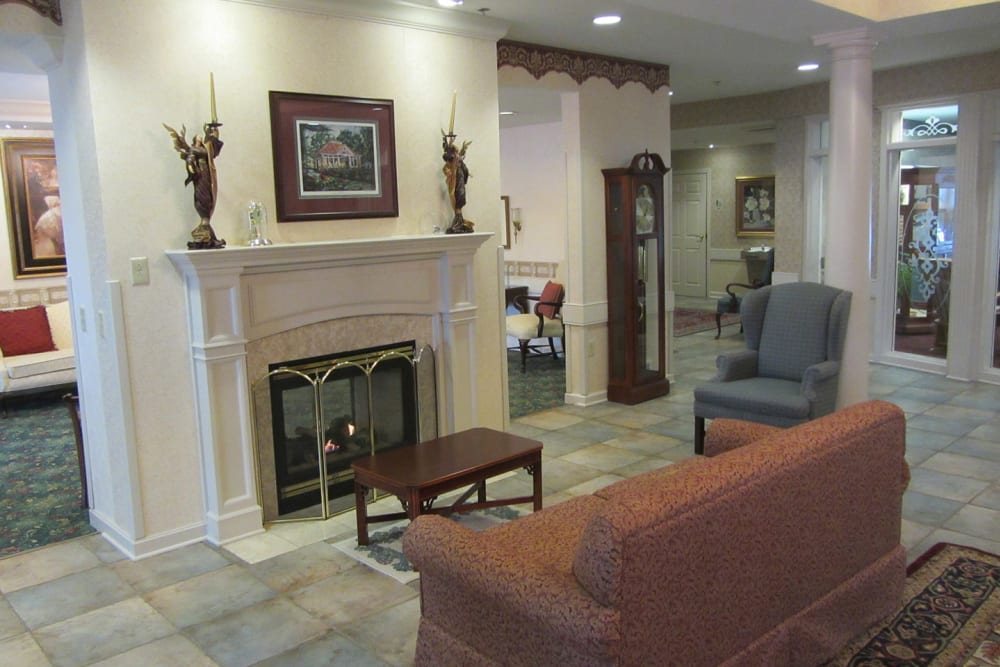 Sitting area in front of a fireplace at Liberty Arms Assisted Living in Youngstown, Ohio