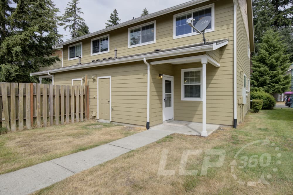 Back yard and exterior view of a home at Beachwood South in Joint Base Lewis McChord, Washington