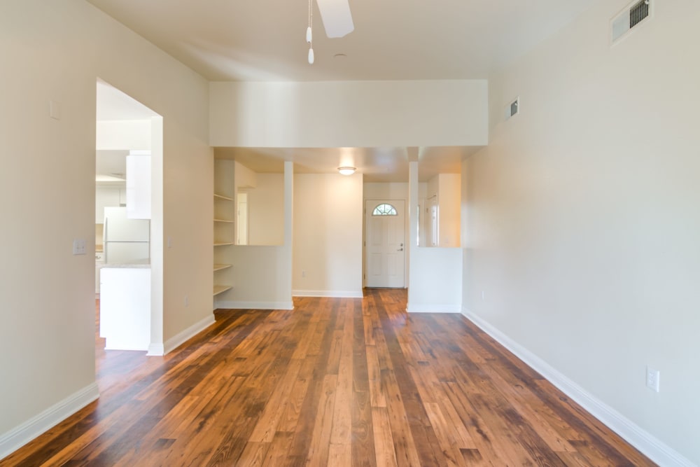 Well lit room with wood flooring in a home at Stuart Mesa in Oceanside, California