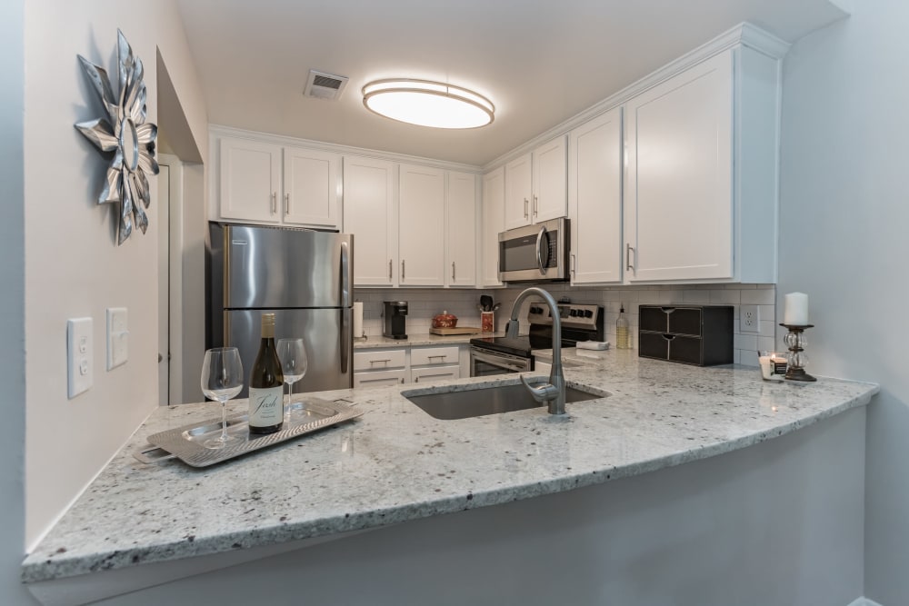 Granite island counter in model kitchen at Eagle Rock Apartments at Columbia in Columbia, Maryland