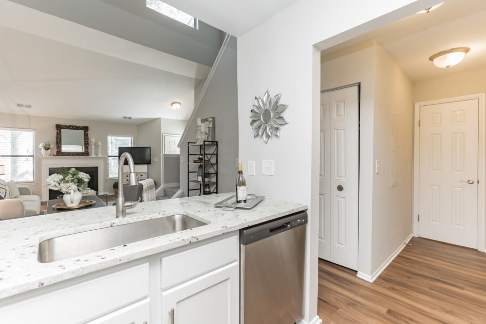 Model kitchen overlooking living room at Eagle Rock Apartments at Columbia in Columbia, Maryland