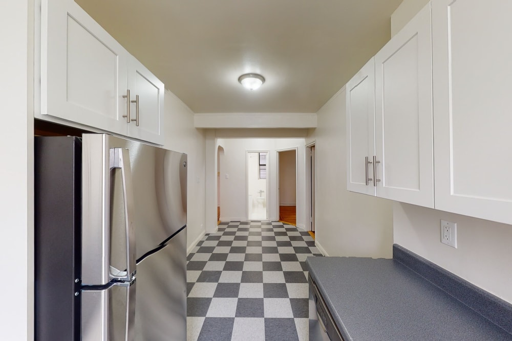 Checked tile style flooring in the kitchen at Eastgold NYC in New York, New York