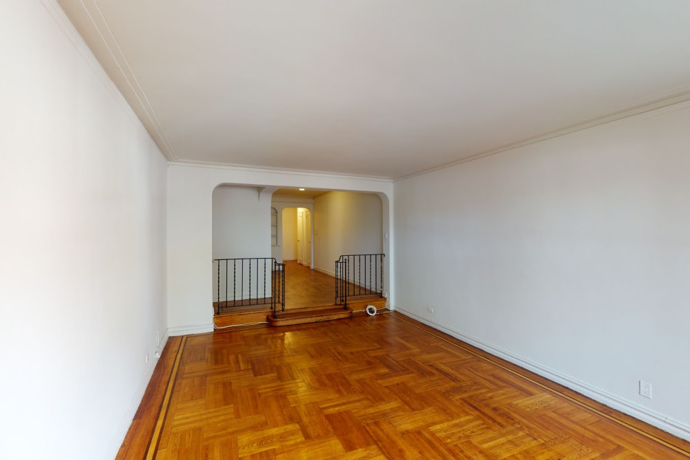Spacious living room area with nice hardwood floors at Eastgold NYC in New York, New York