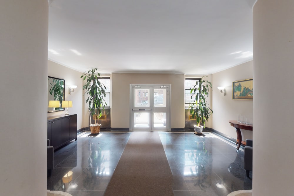 Spacious lobby area where residents enter the building at Eastgold NYC in New York, New York