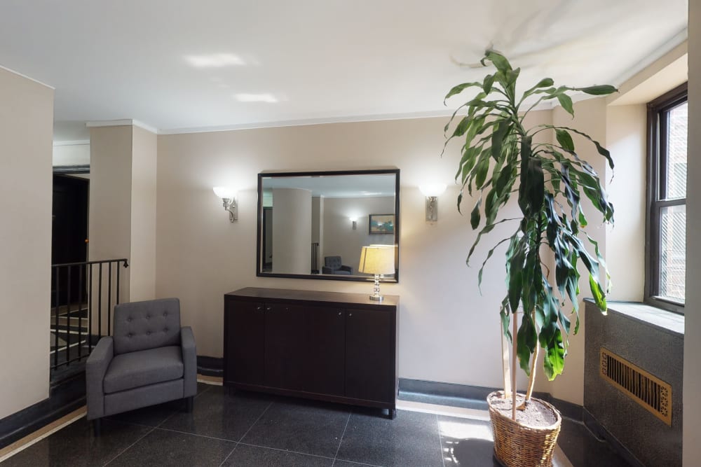 Spacious lobby area with some nice decor and plants at Eastgold NYC in New York, New York