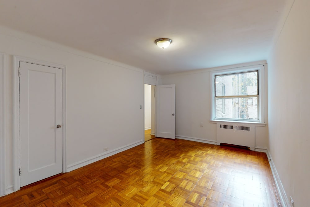 Spacious and well lit living area at Eastgold NYC in New York, New York