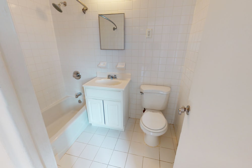 Cute vanity with small mirror above it in the bathroom at Eastgold NYC in New York, New York