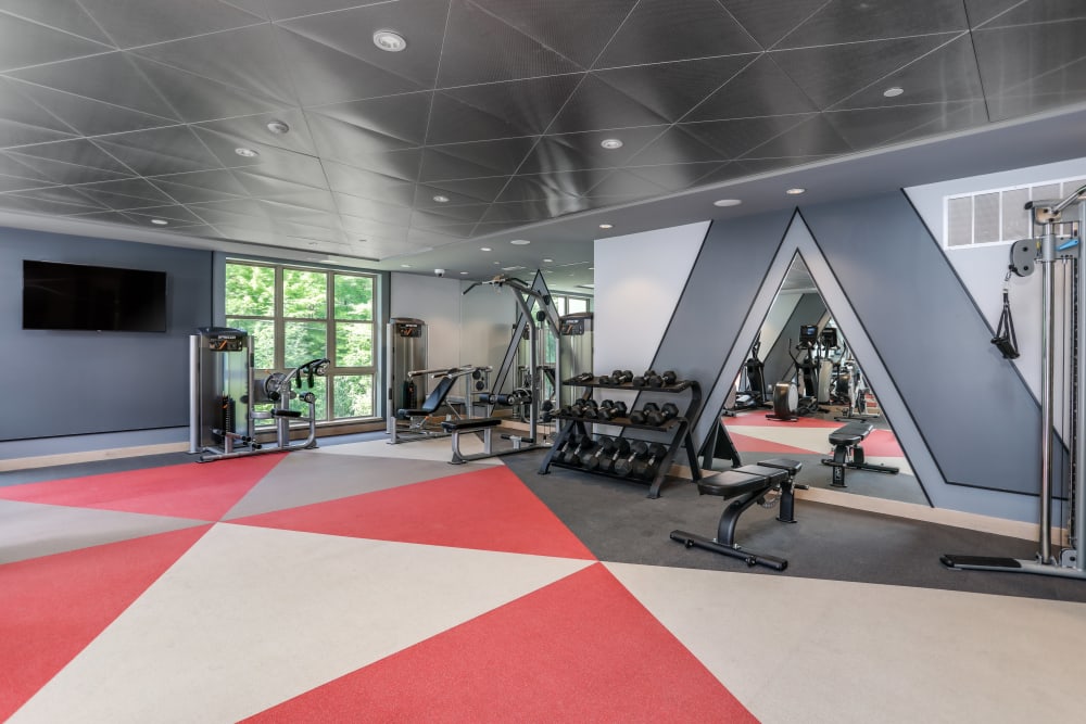 Fitness center with red accents at Town Court in West Bloomfield, Michigan