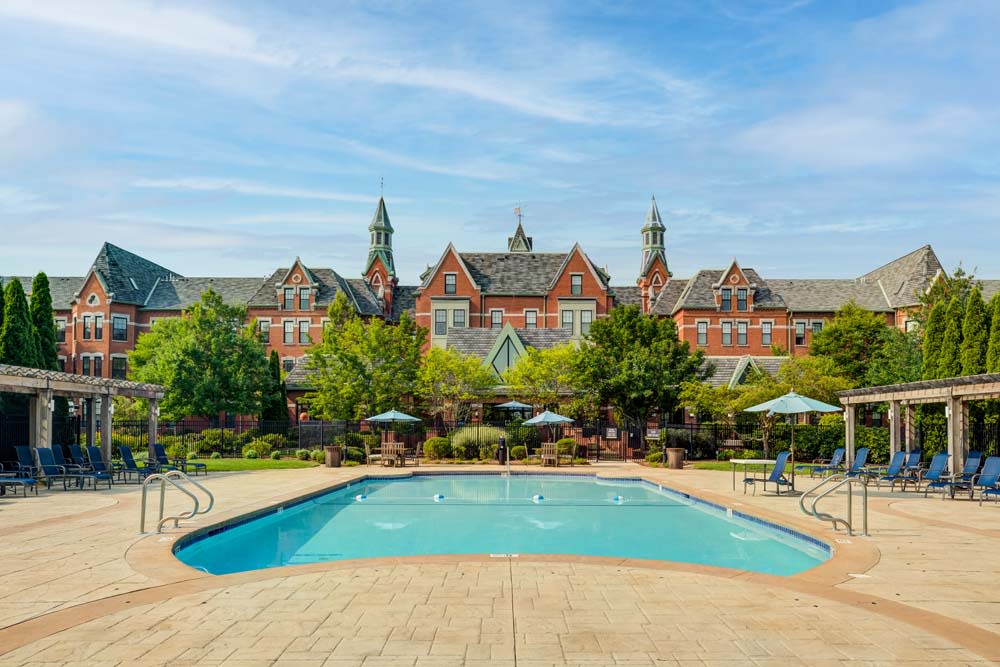 pool with building in the background at Bradlee Danvers in Danvers, Massachusetts