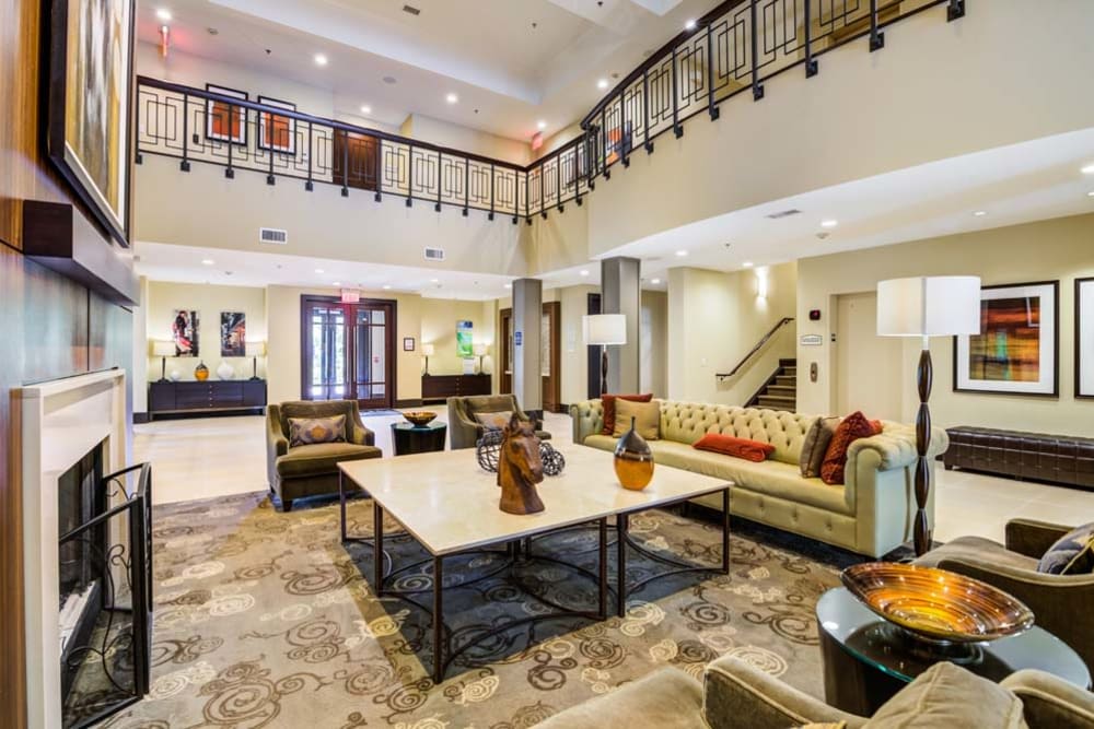 Well decorated community clubhouse with high ceilings and plenty of sitting spaces at The Grove Somerset in Somerset, New Jersey