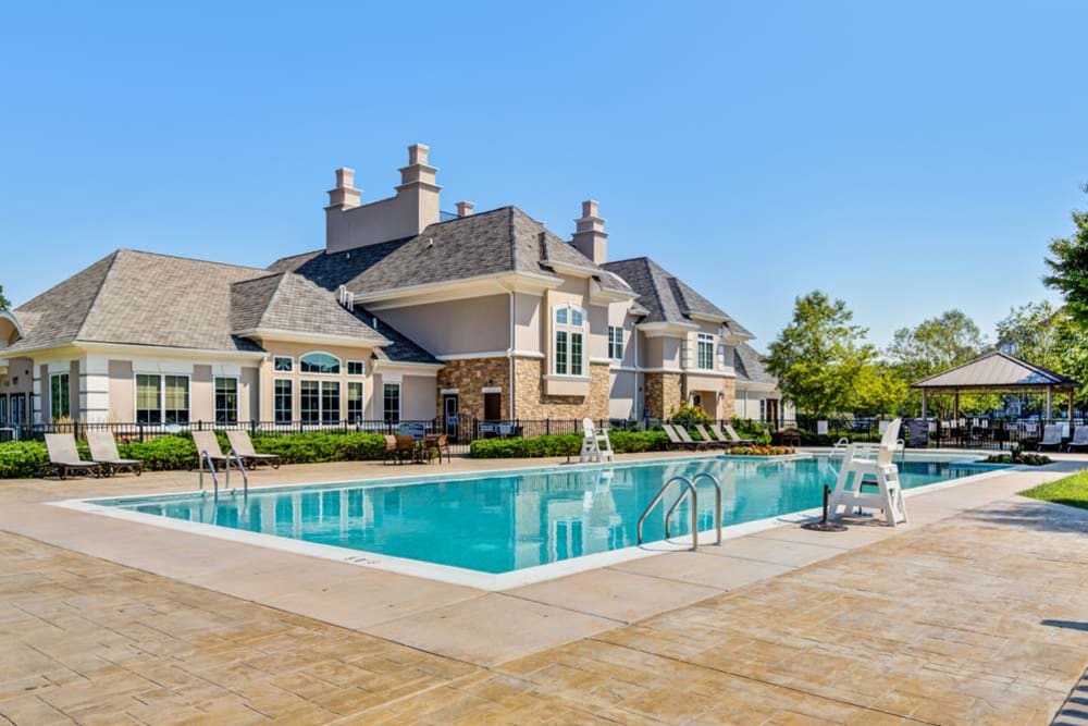 Outdoor community pool and clubhouse at The Grove Somerset in Somerset, New Jersey