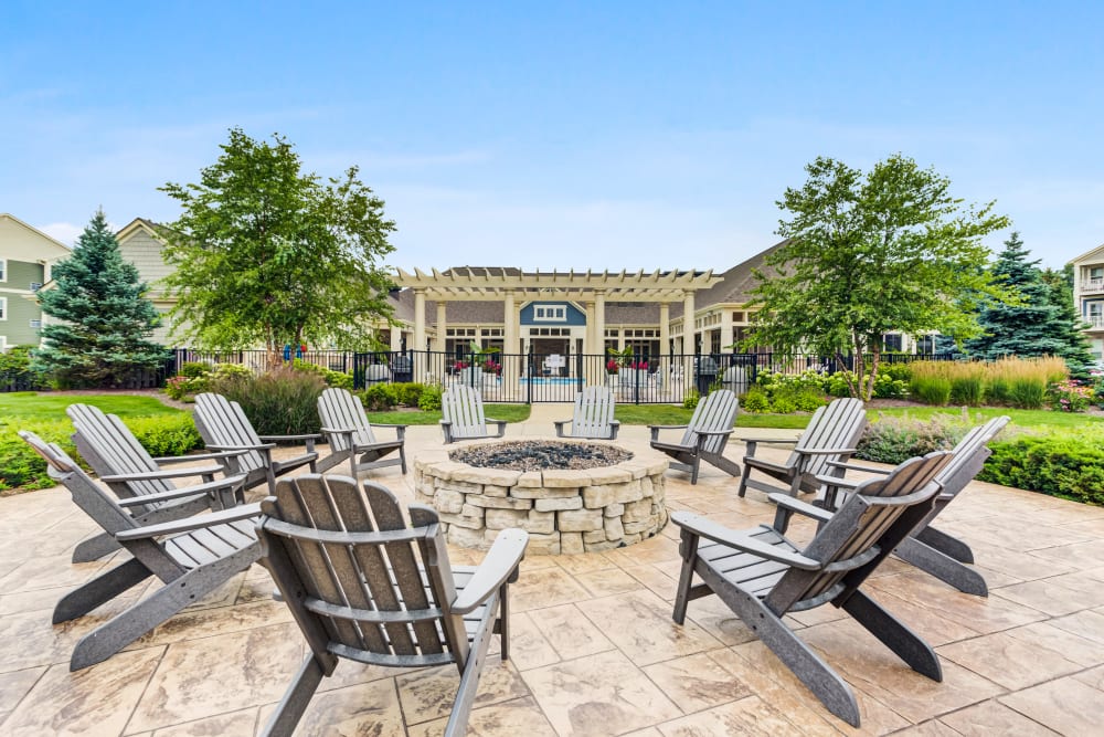 Adirondack chairs by outdoor fire pit at The Oaks Of Vernon Hills in Vernon Hills, IL