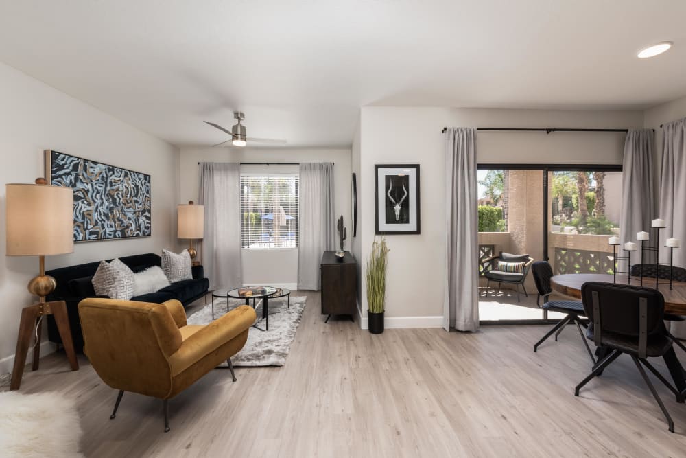 Beautiful open-concept floor plan with hardwood floors in a model home at Elite North Scottsdale in Scottsdale, Arizona