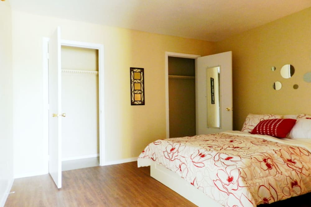 Model bedroom with a large closet at Riverbend in Arlington, Texas