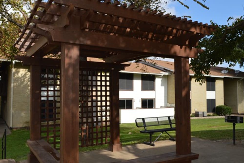 Pergola with a park bench and grilling station at Vista Park in Dallas, Texas