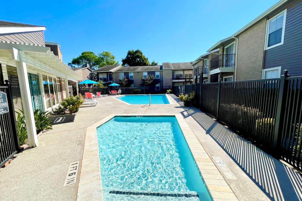 Swimming pool area at The Abbey at Willowbrook in Houston, Texas