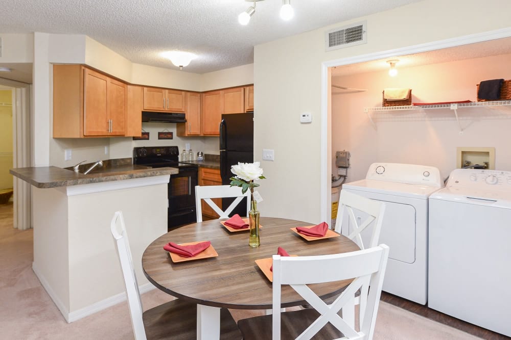 Fully equipped kitchen and dinning table at Promenade Apartment Homes in Winter Garden, Florida