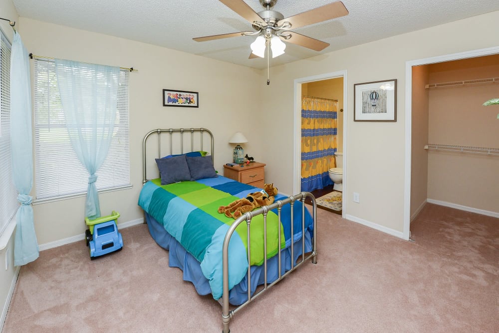 Cozy bedroom at Promenade Apartment Homes in Winter Garden, Florida
