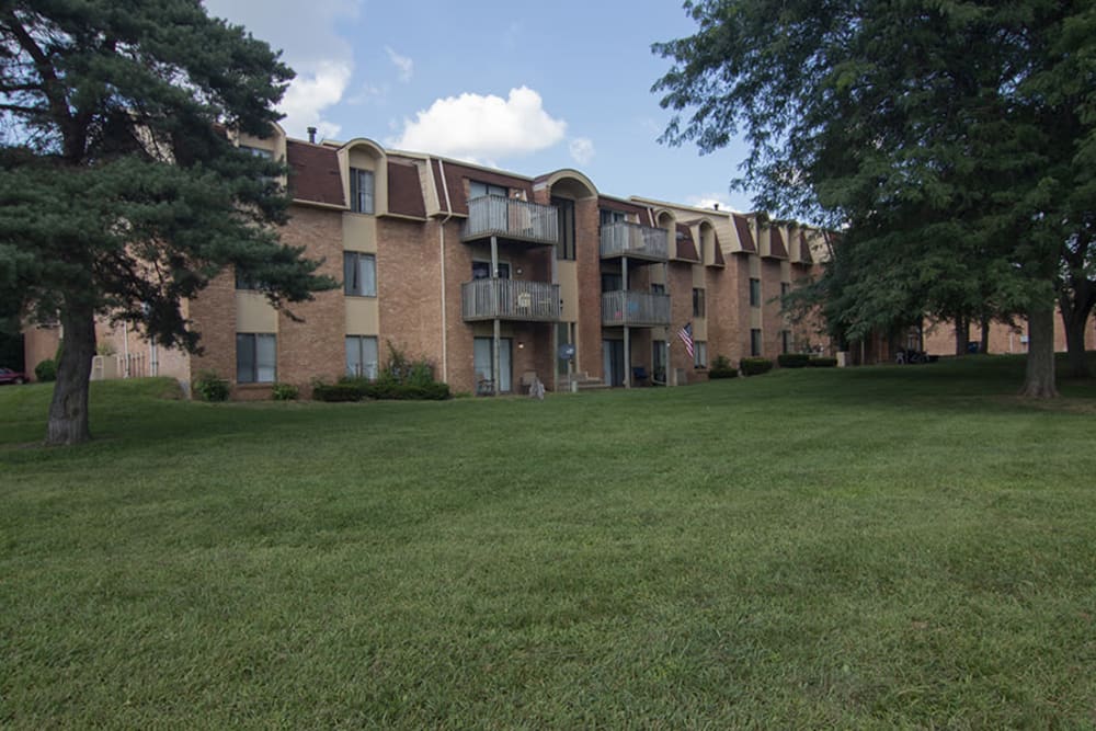 A spacious grassy area at Arbors of Battle Creek Apartments & Townhomes in Battle Creek, Michigan