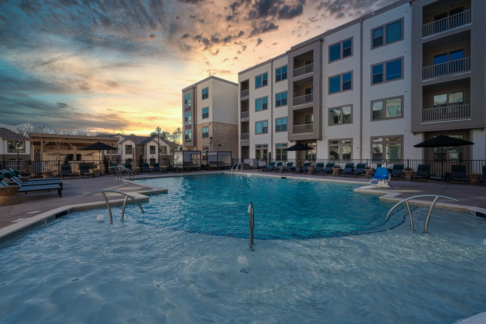 Resort-style swimming pool with sundeck at The Reserve at Patterson Place in Durham, North Carolina