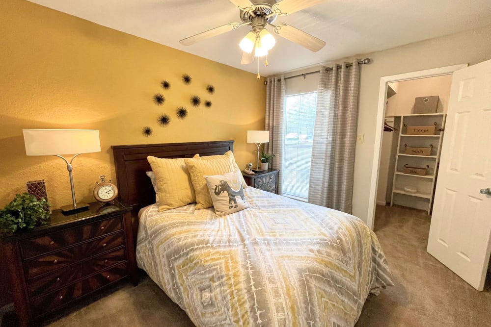 Bedroom in a model apartment at The Abbey at Briar Forest in Houston, TX