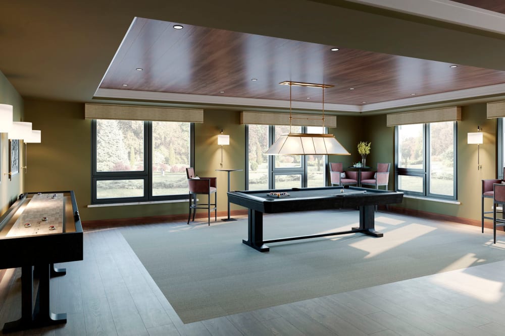 Billiards, tabletop shuffleboard, and more in the clubhouse game room at Amira Bloomington in Bloomington, Minnesota 