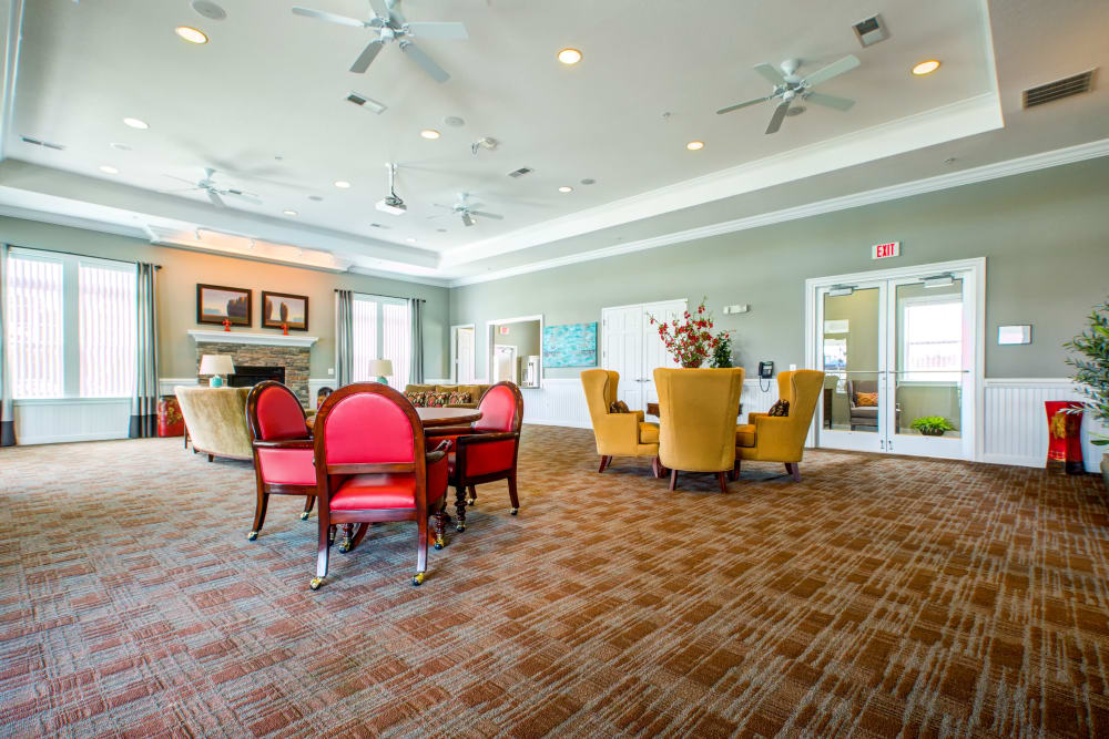Indoor community facility with carpeting and seating at Heroes Manor in Camp Lejeune, North Carolina