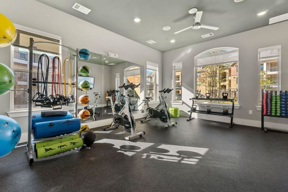 State of the art fitness center and equipment rack at Auberge of Burleson in Burleson, Texas