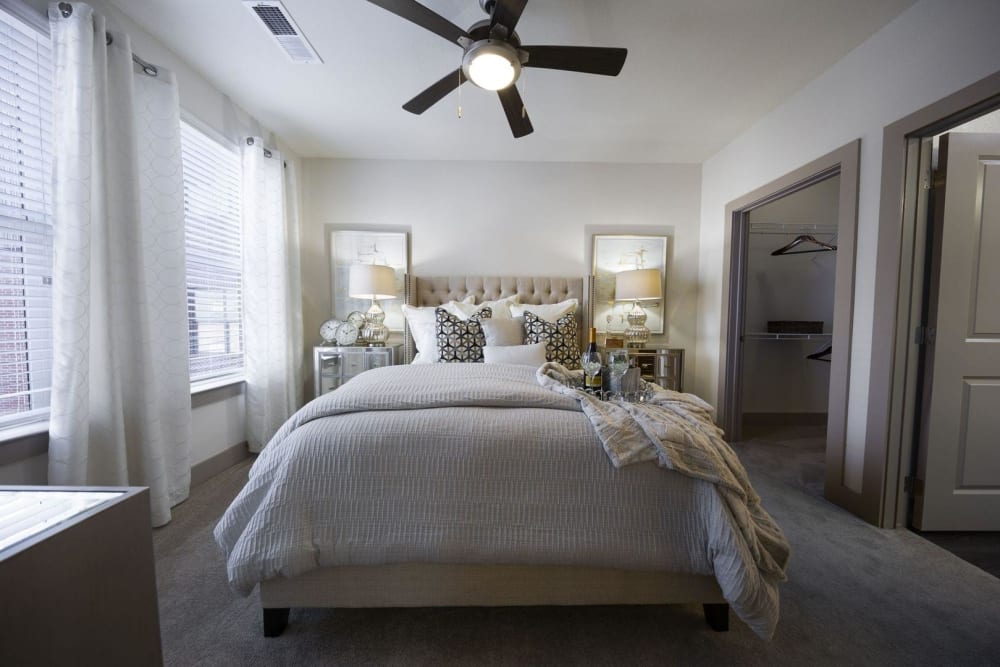 Model bedroom with a large walk-in closet at Steelyard in Oklahoma City, Oklahoma