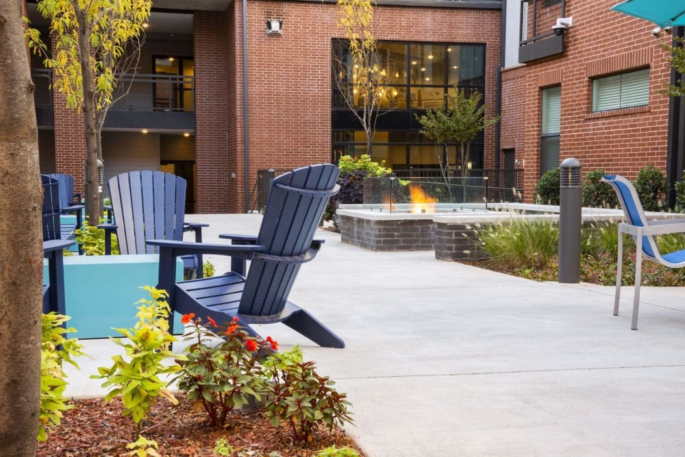 Firepit and outdoor lounge area with Adirondack chairs at Steelyard in Oklahoma City, Oklahoma