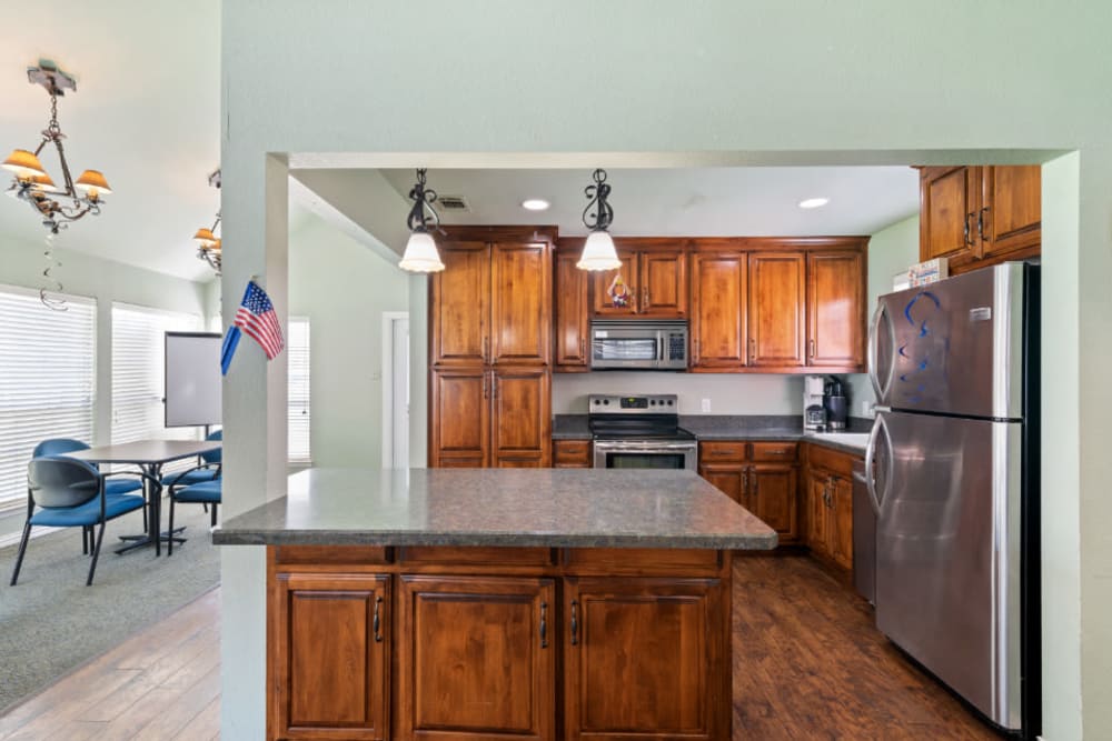 spacious kitchen with an island at Truewood by Merrill, River Park in Fort Worth, Texas