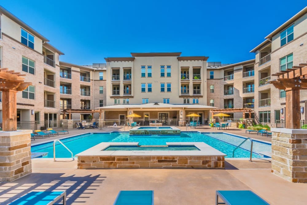 Shimmering pool at the heart of the community at Atlas Point at Prestonwood in Carrollton, Texas