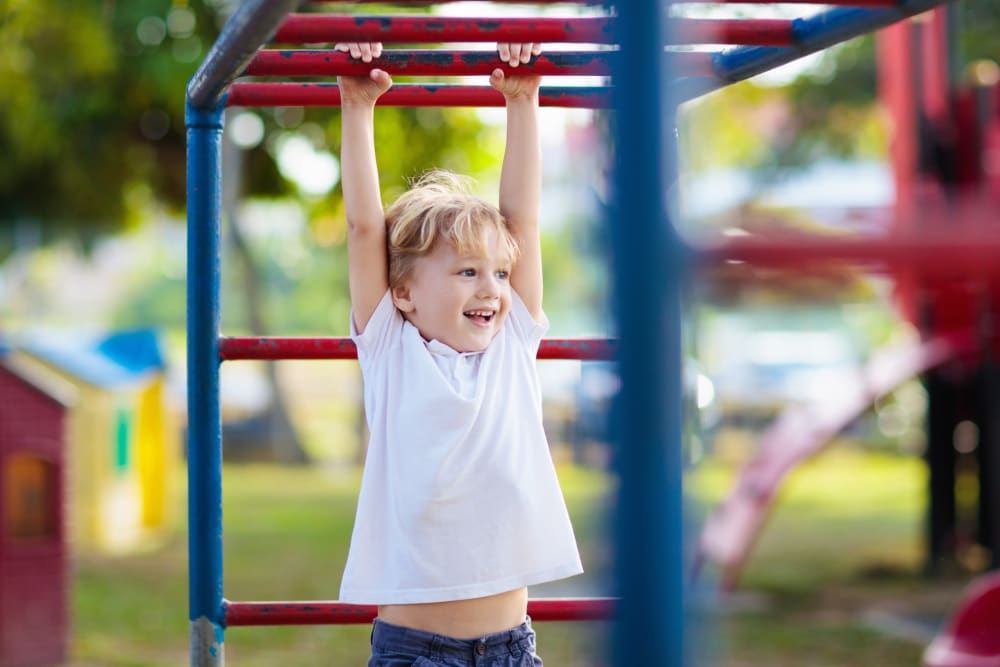 kid on the playground at Adobe Flats II in Twentynine Palms, California