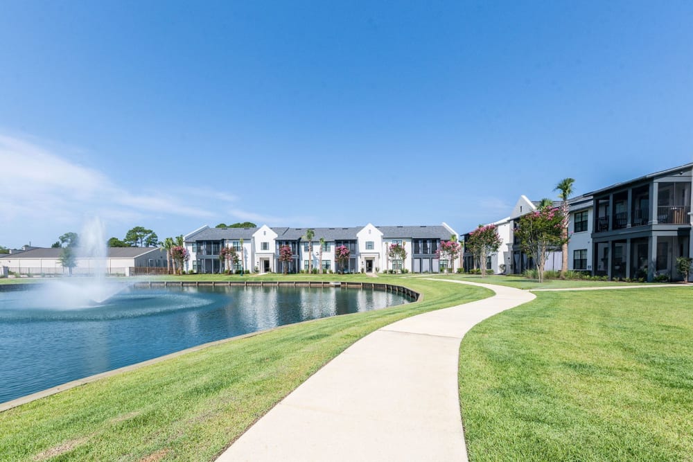 Walkway next to pond at The Residences at 393 North in Santa Rosa Beach, Florida
