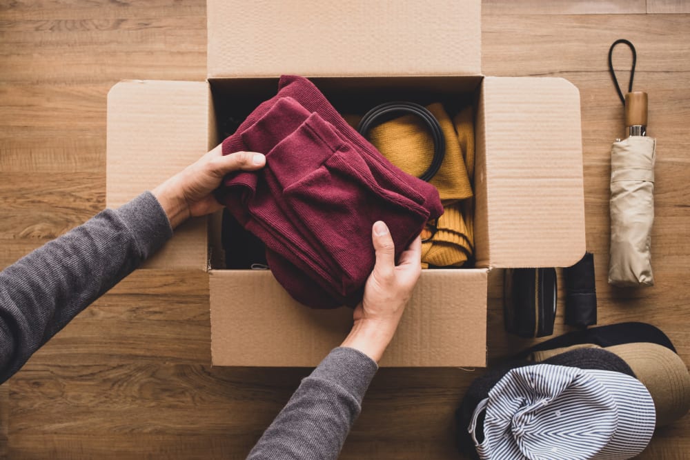 A customer packing a box to Emerald Heated Self Storage in Puyallup, Washington.
