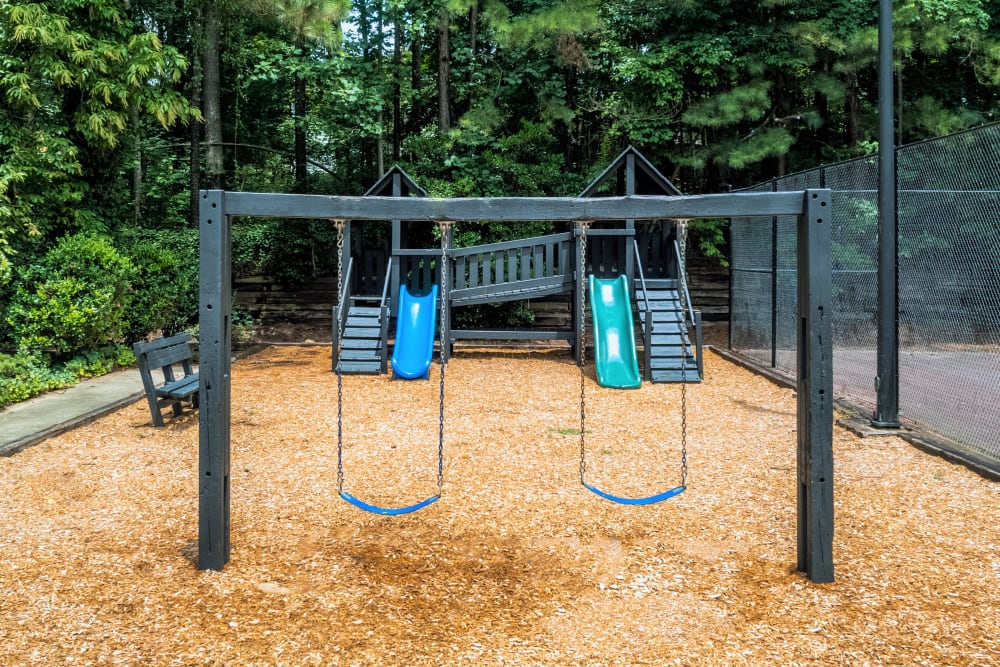 Swings at playground at Lake Crossing apartment homes in Austell, Georgia