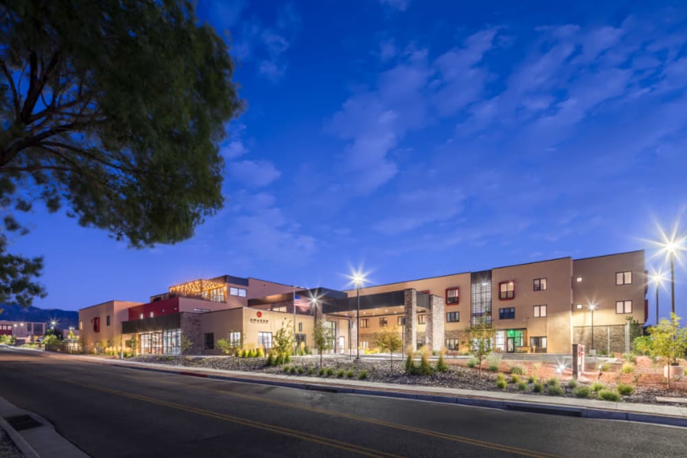 Panoramic exterior view of Amaran Senior Living at dusk in Albuquerque, New Mexico