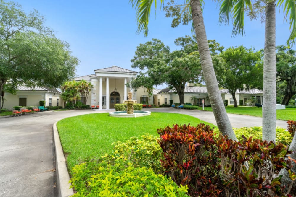 Long driveway leading to front entrance at Truewood by Merrill, Bradenton in Bradenton, Florida
