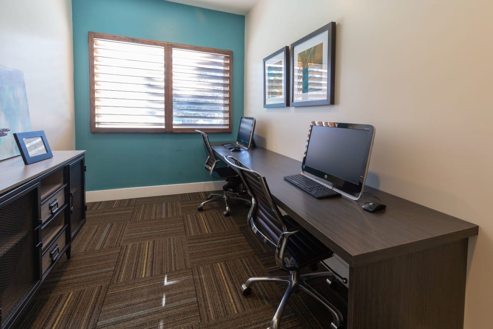 Stay connected with computers in the community business center at Royal Ridge Apartments in Midvale, Utah