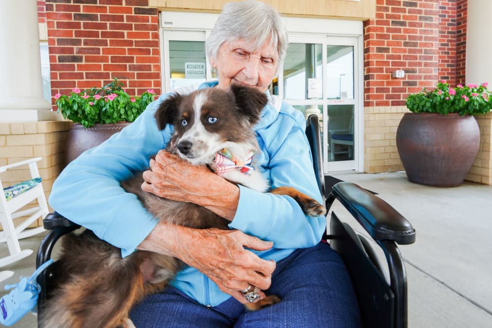 Resident and her pet The Harmony Collection at Hanover in Mechanicsville, Virginia