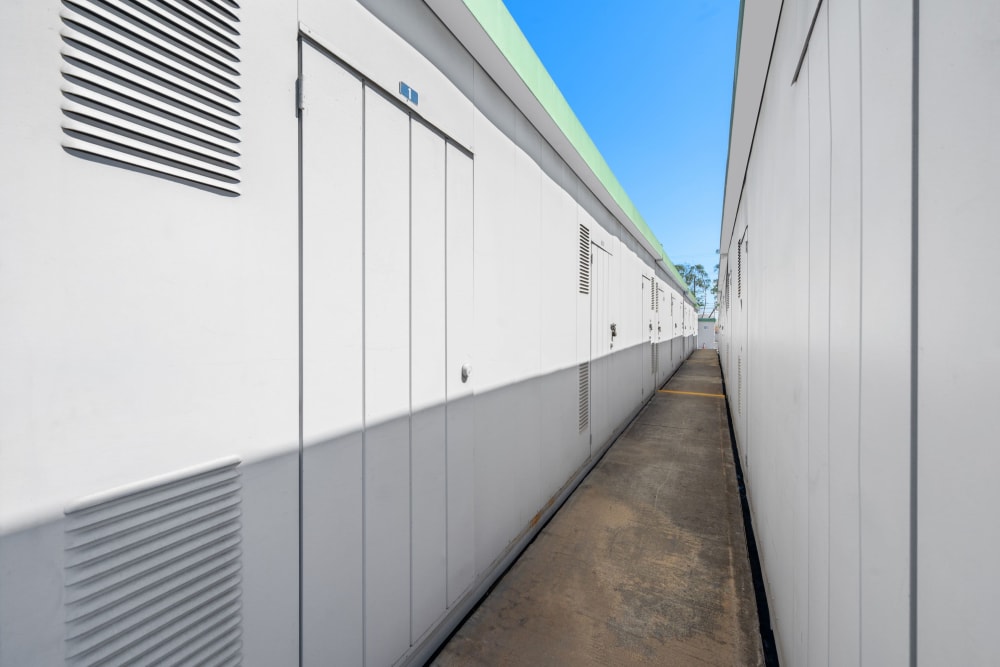 Narrow walkway lined with units at Storage Etc... Carson in Carson, California
