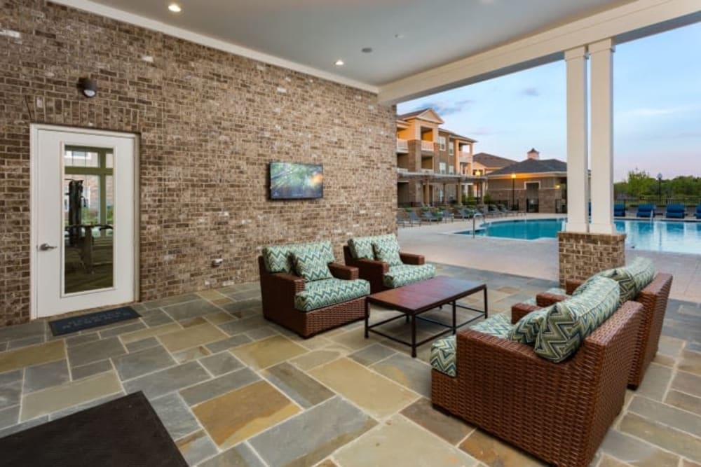 Poolside outdoor lounge at Haywood Reserve Apartment Homes in Greenville, South Carolina